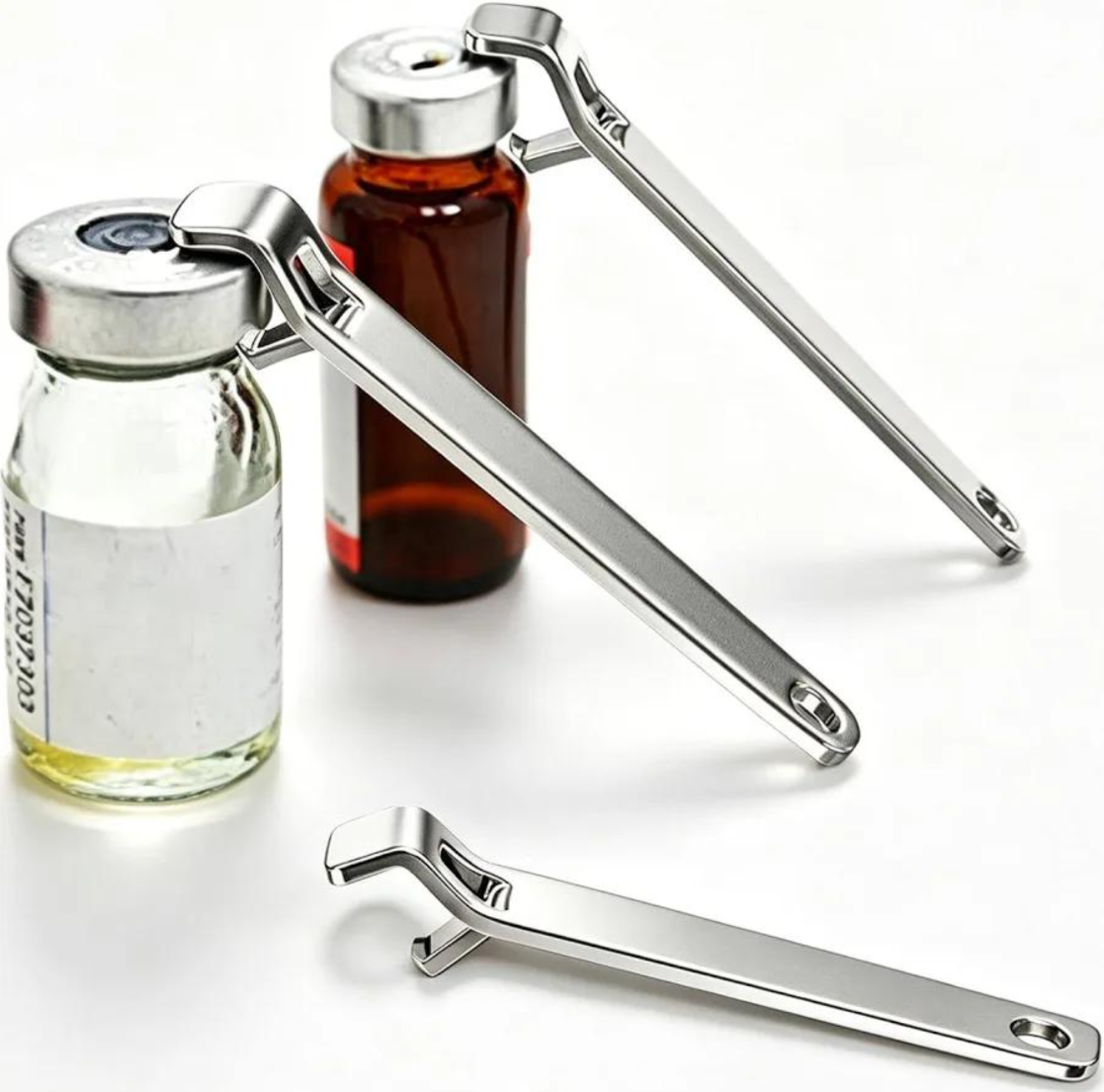 Stainless steel vial openers removing flip-off caps from clear and amber glass vials